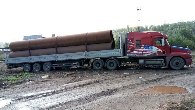 фото трала с бортами для перевозки грузов